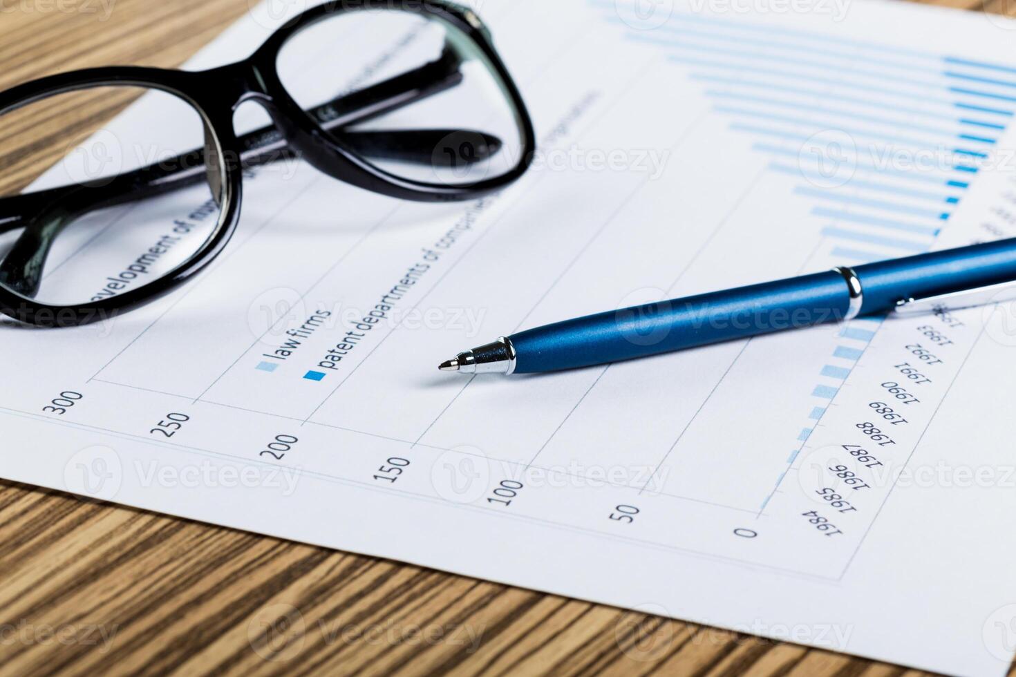 Financial paper charts and graphs on the table. photo