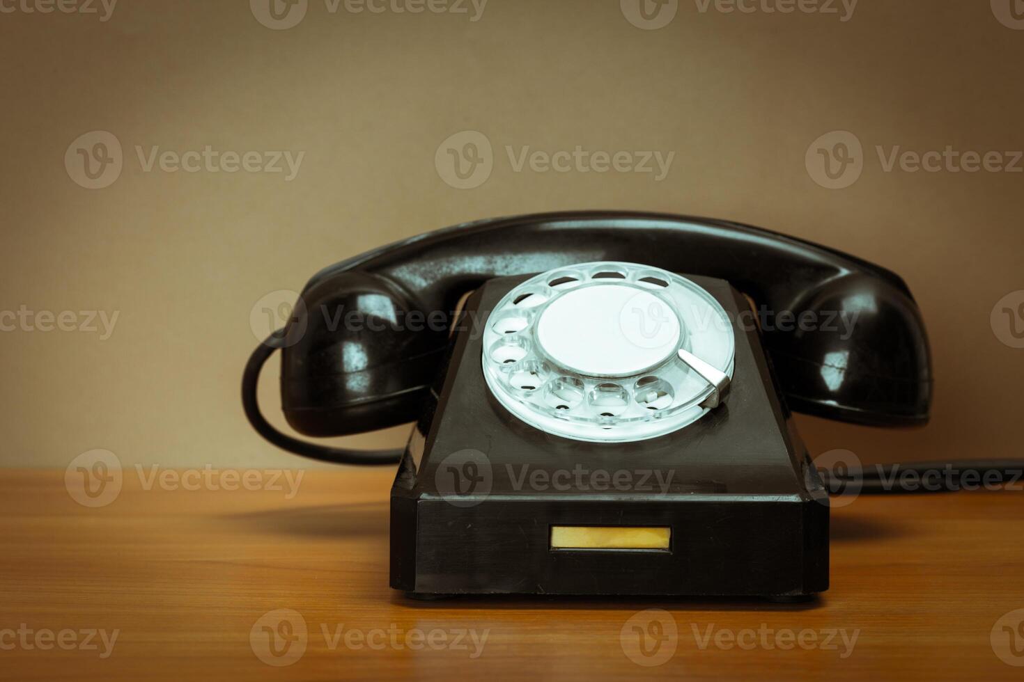 Retro telephone on table photo