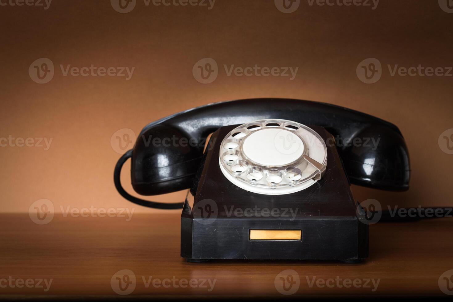 Retro telephone on table photo