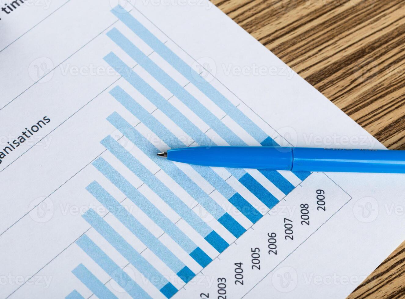 Financial paper charts and graphs on the table. photo