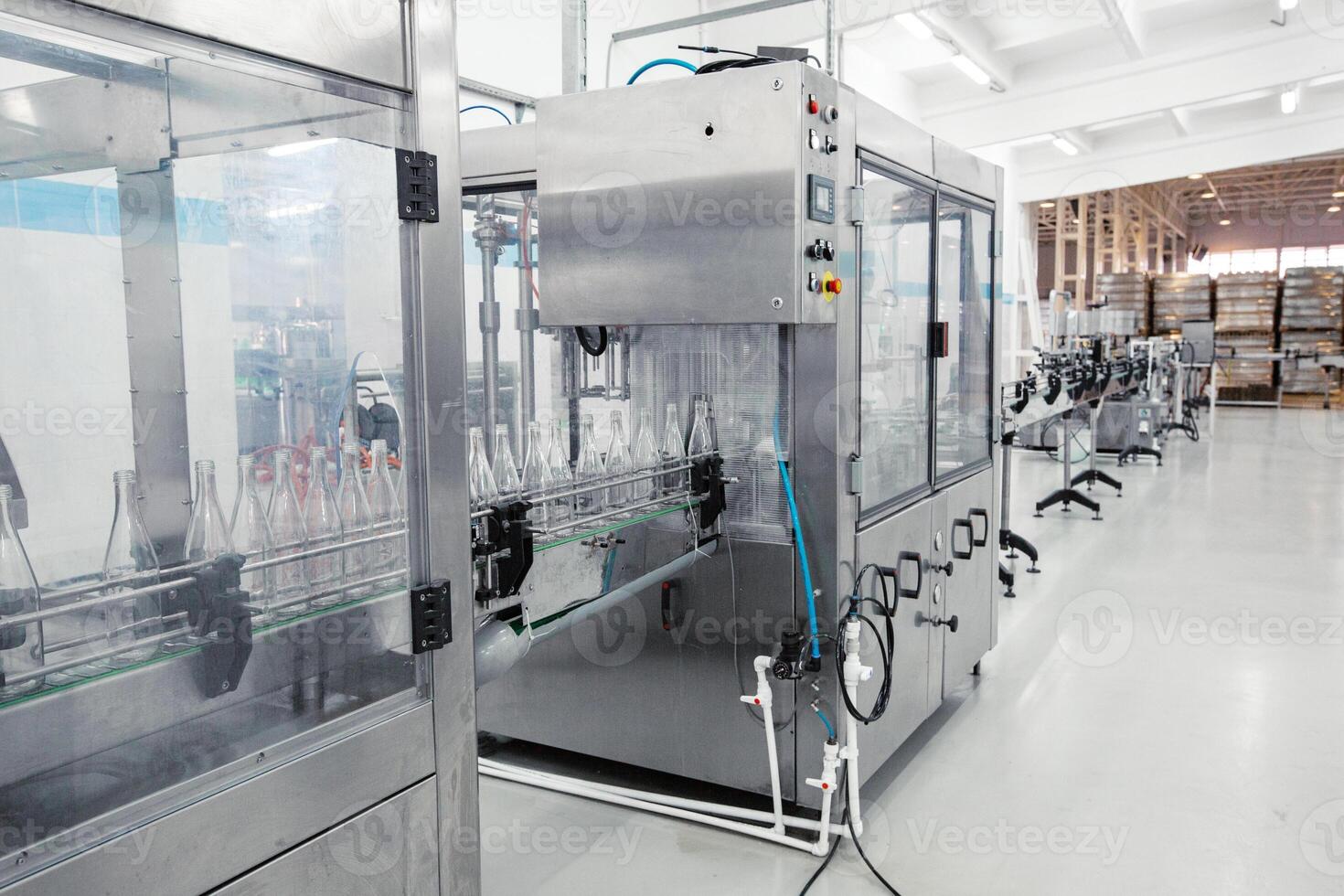 Advanced bottling machine operates in a modern beverage manufacturing facility during daylight hours photo