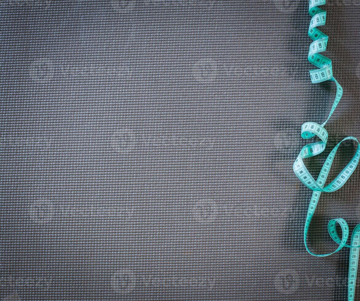 board with a tailor measuring tape photo