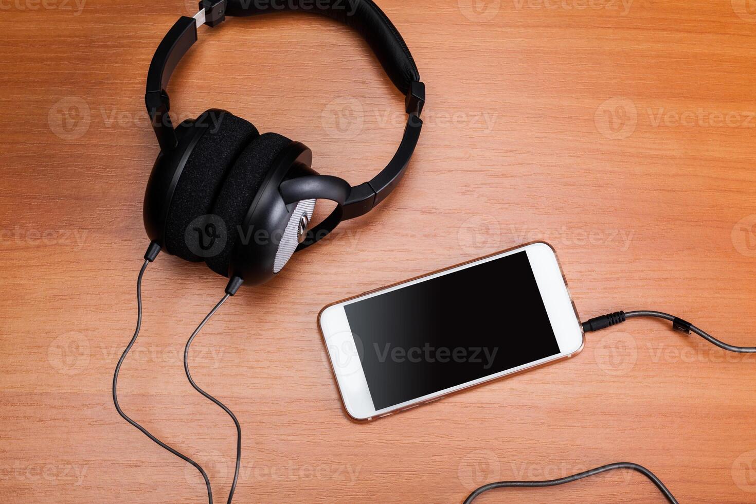 headphones on wooden background photo