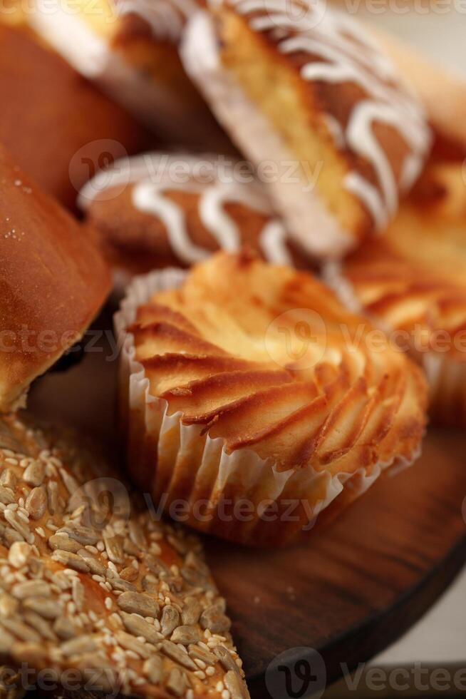 Delicious assortment of baked goods on a wooden platter ready for enjoyment at a casual gathering photo