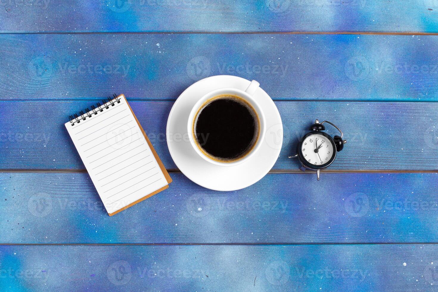 Mockup for check list, empty note paper with coffee cup on blue wood background. photo
