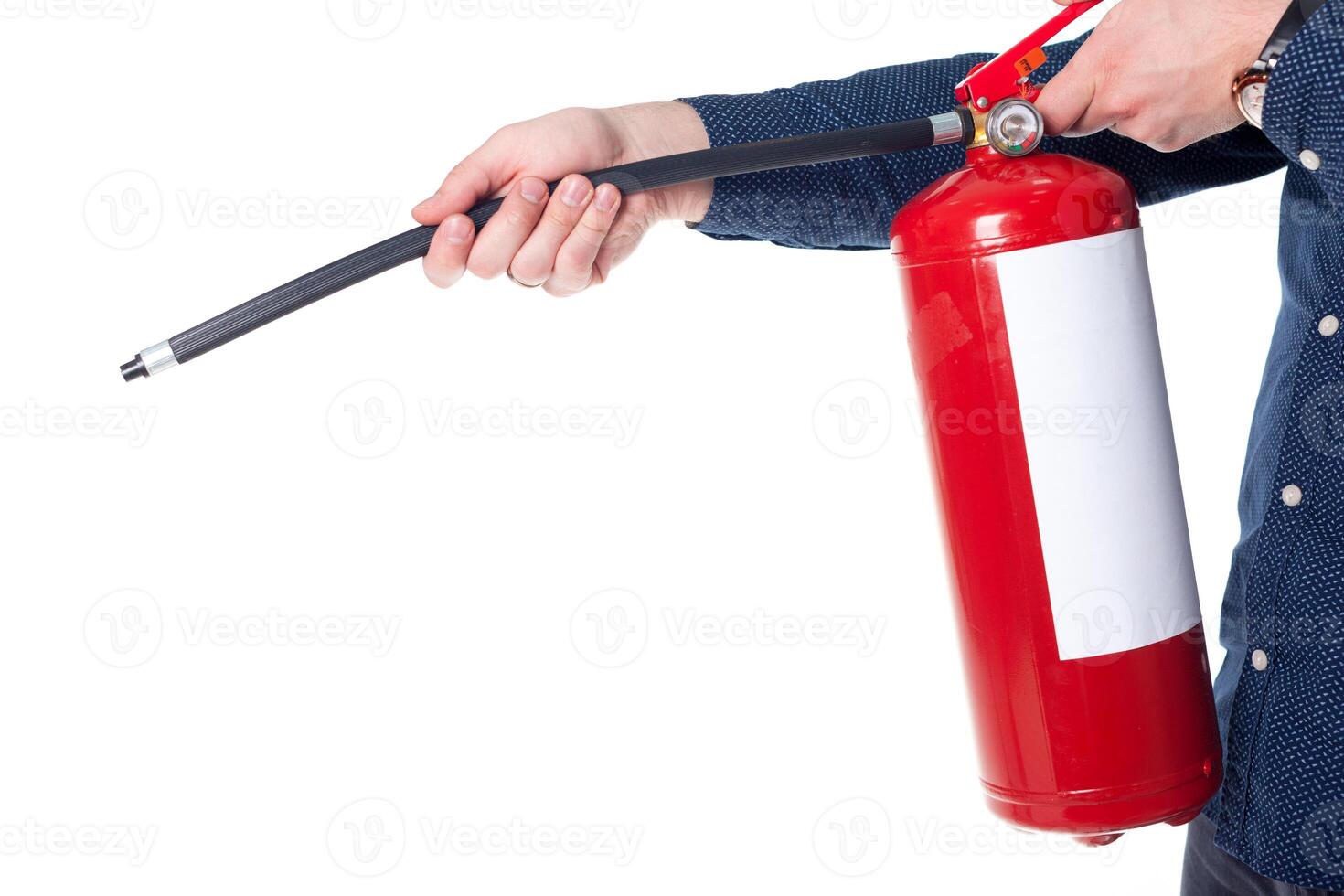 Man using fire extinguisher isolated on white photo