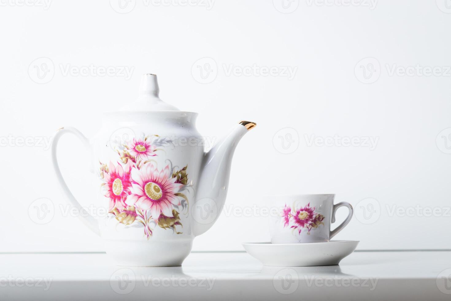Cup of tea with teapot in vintage style photo