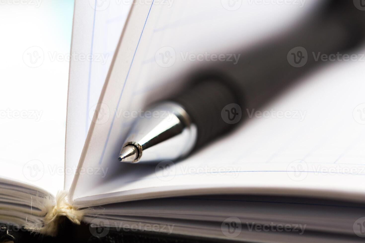 Pen and notebook close up photo