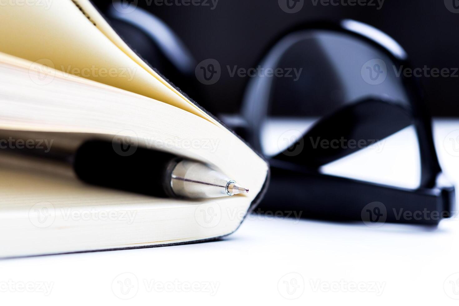 Pen and notebook close up photo