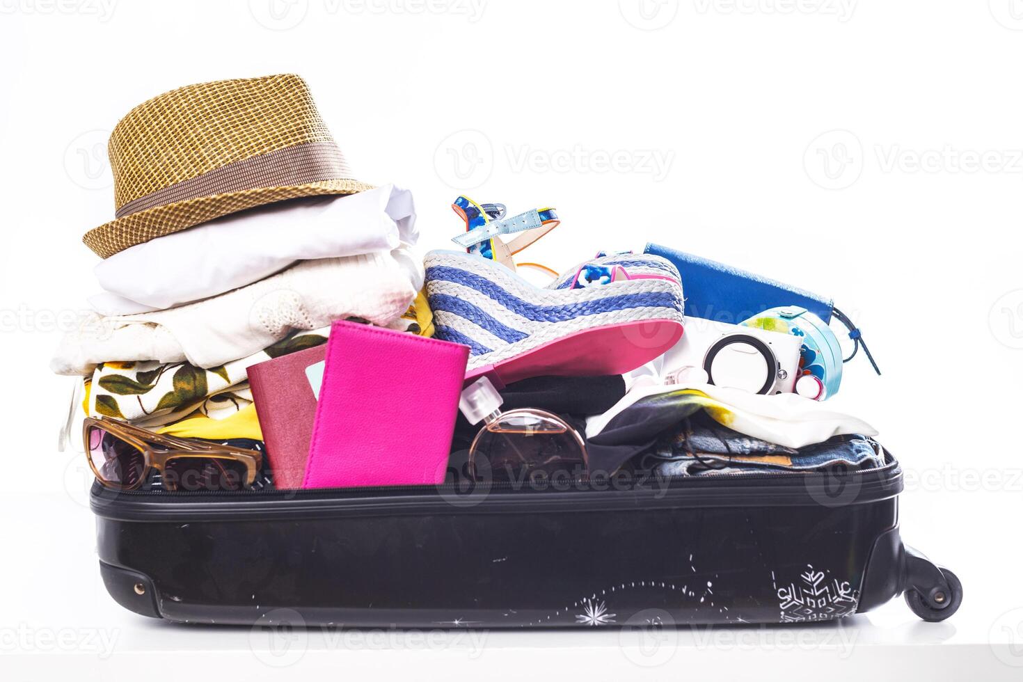 Packing suitcase for trip isolated on white photo