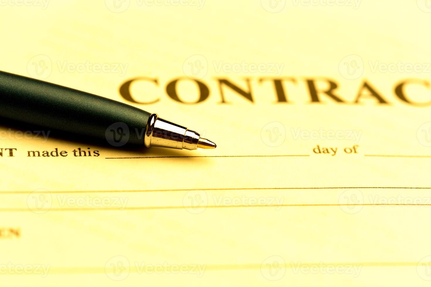 Close-up of pen on contract photo
