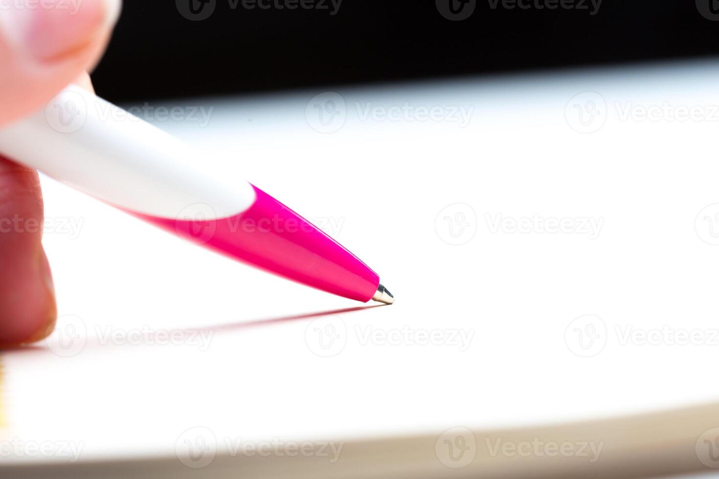 Pen and notebook close up photo