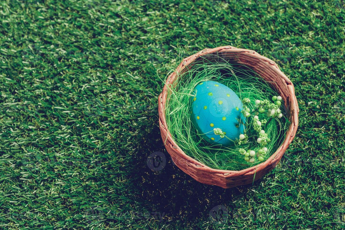 Colorful easter eggs on green grass photo