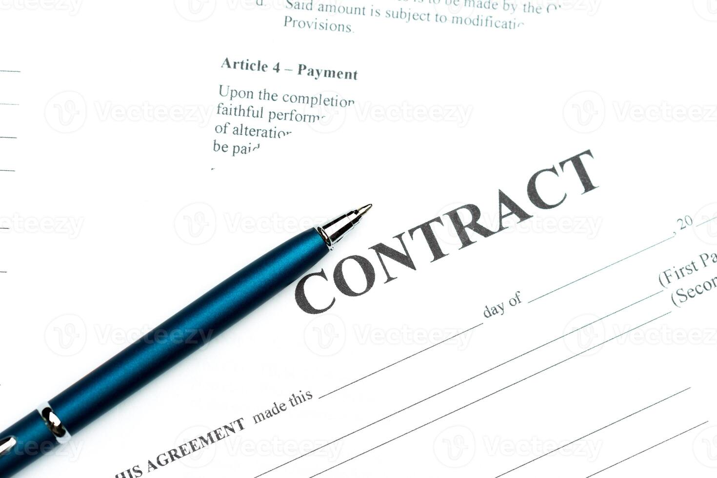 Close-up of pen on contract photo