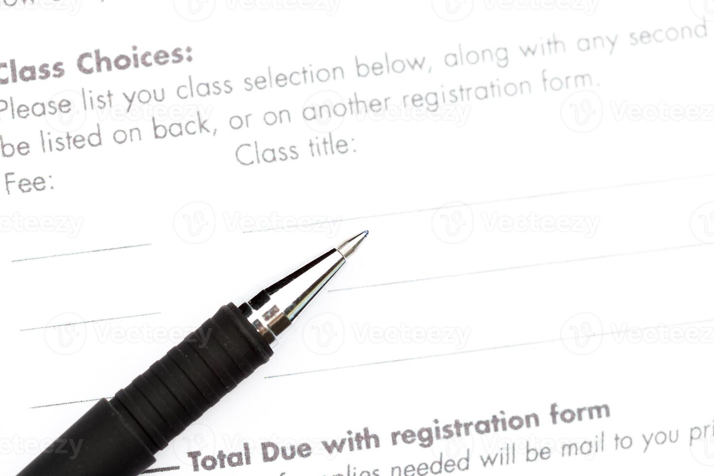 Close-up of pen on contract photo
