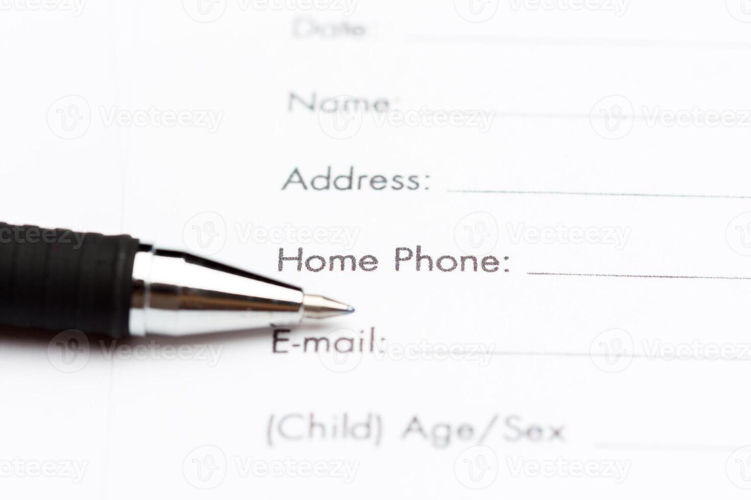 Close-up of pen on contract photo