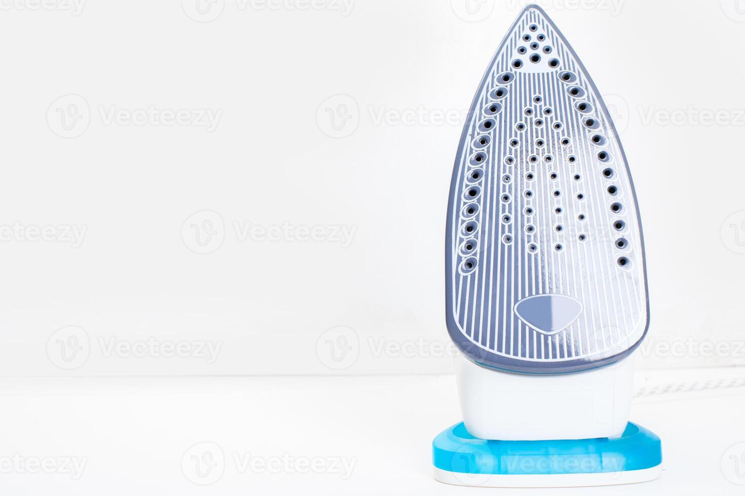 Steam iron isolated on white background photo