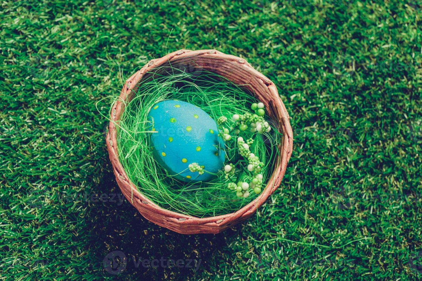 Colorful easter eggs on green grass photo