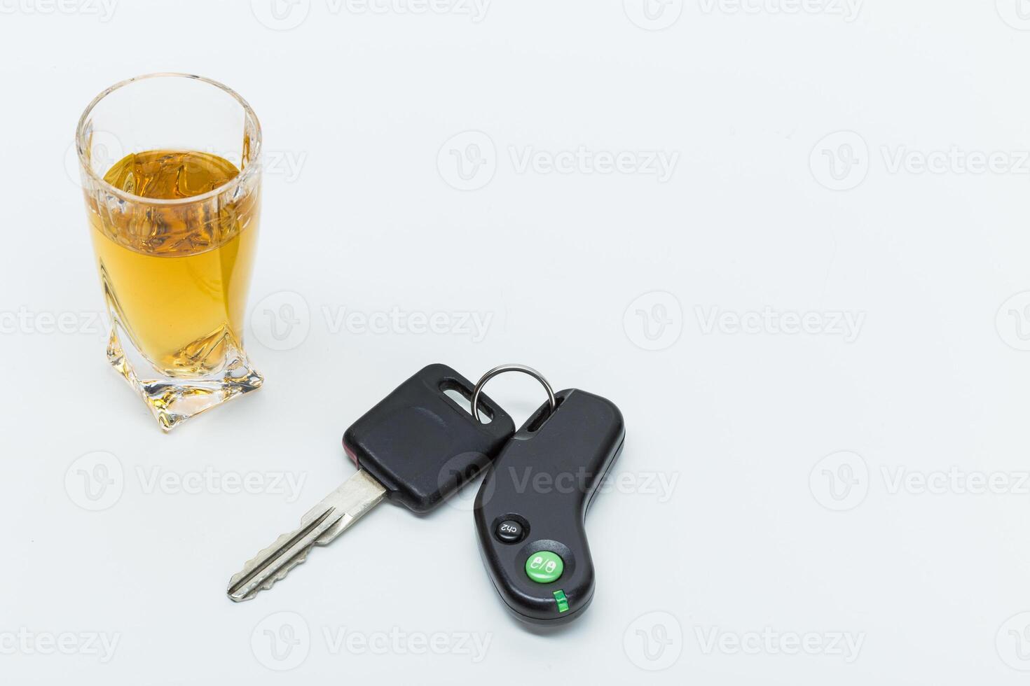 Car key on the bar with spilled alcohol photo