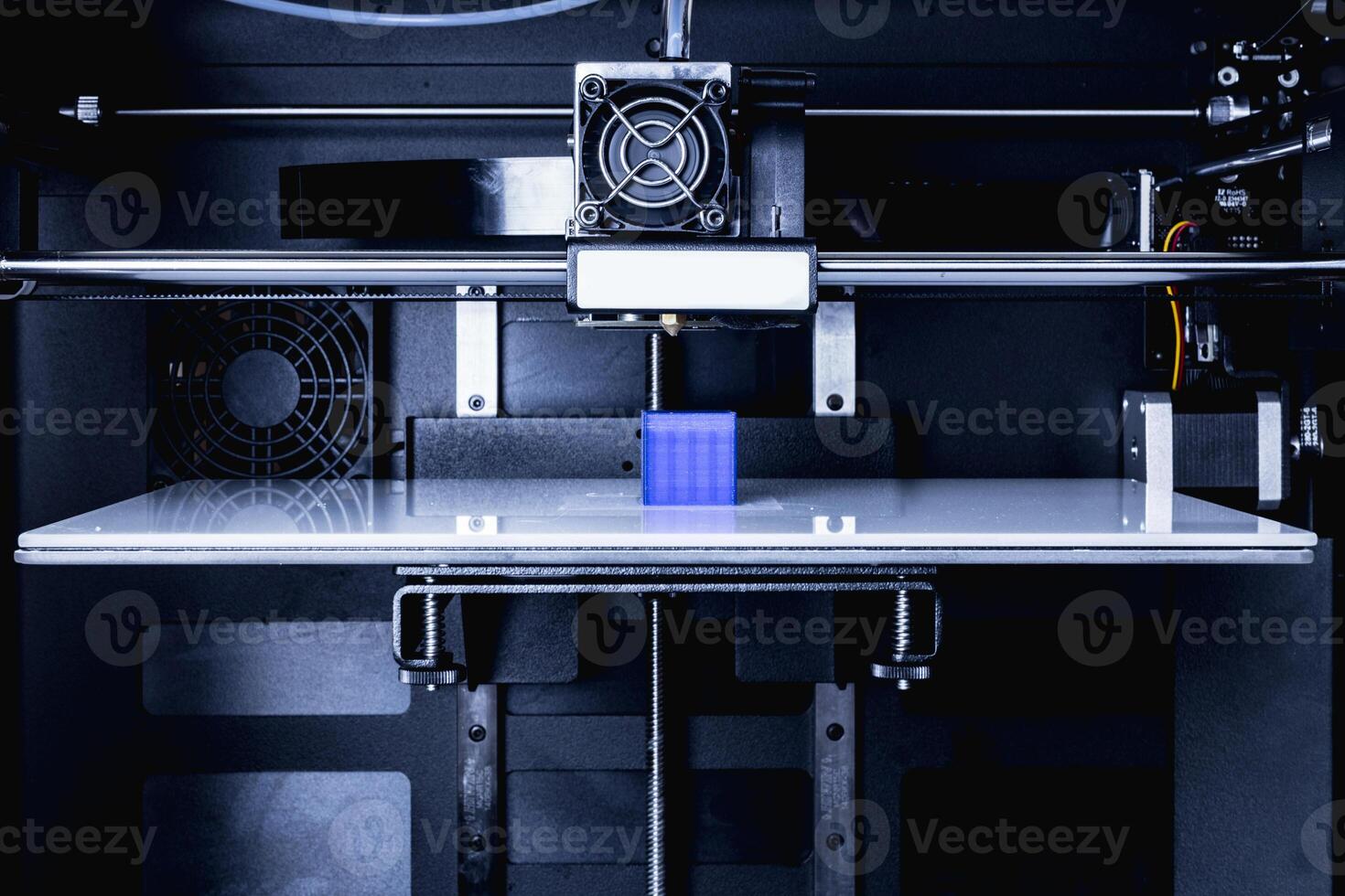 head of 3d printer in action photo