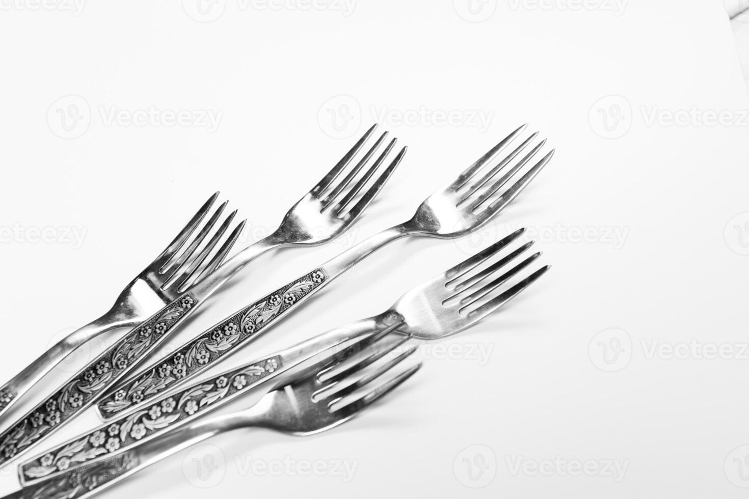 Old metal forks isolated on a white background. photo