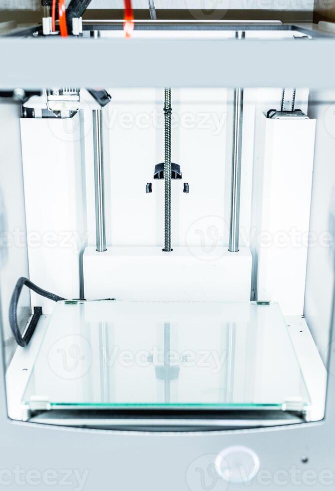 3d printer with bright red filament. photo