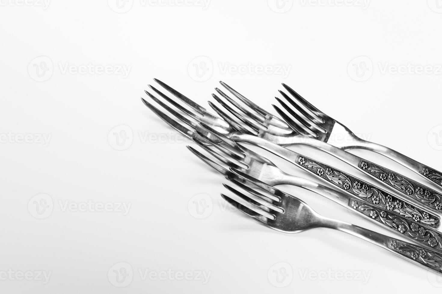 Old metal forks isolated on a white background. photo