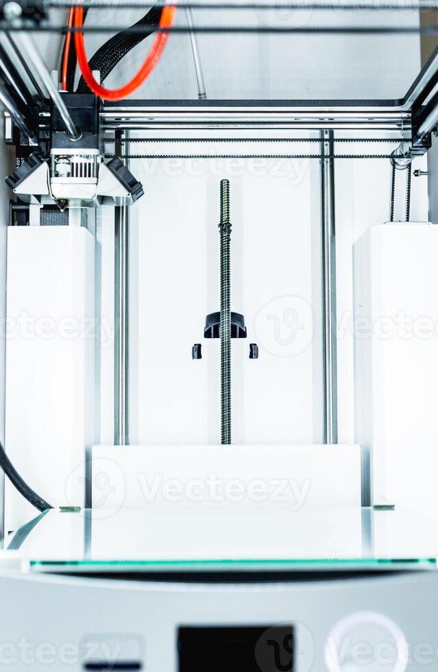 3d printer with bright red filament. photo