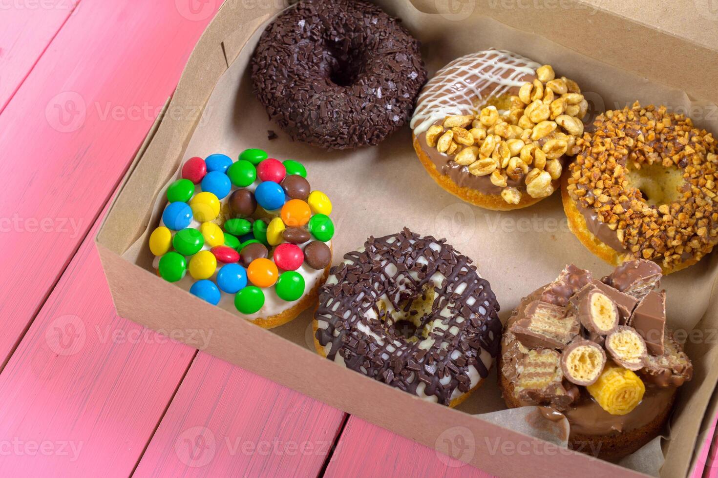 Colorful donuts in box photo