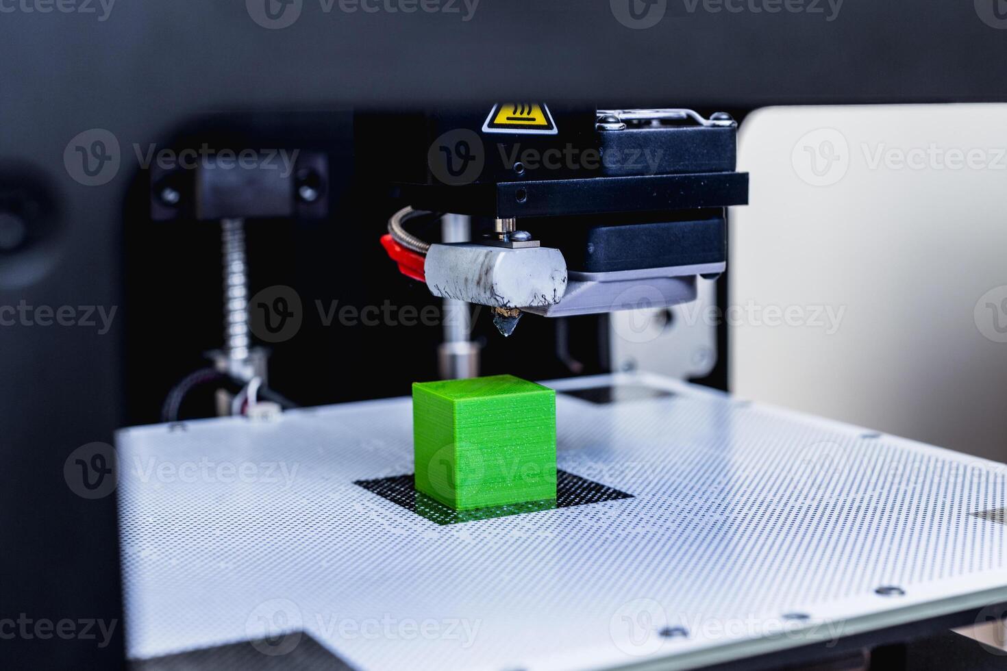 head of 3d printer in action photo