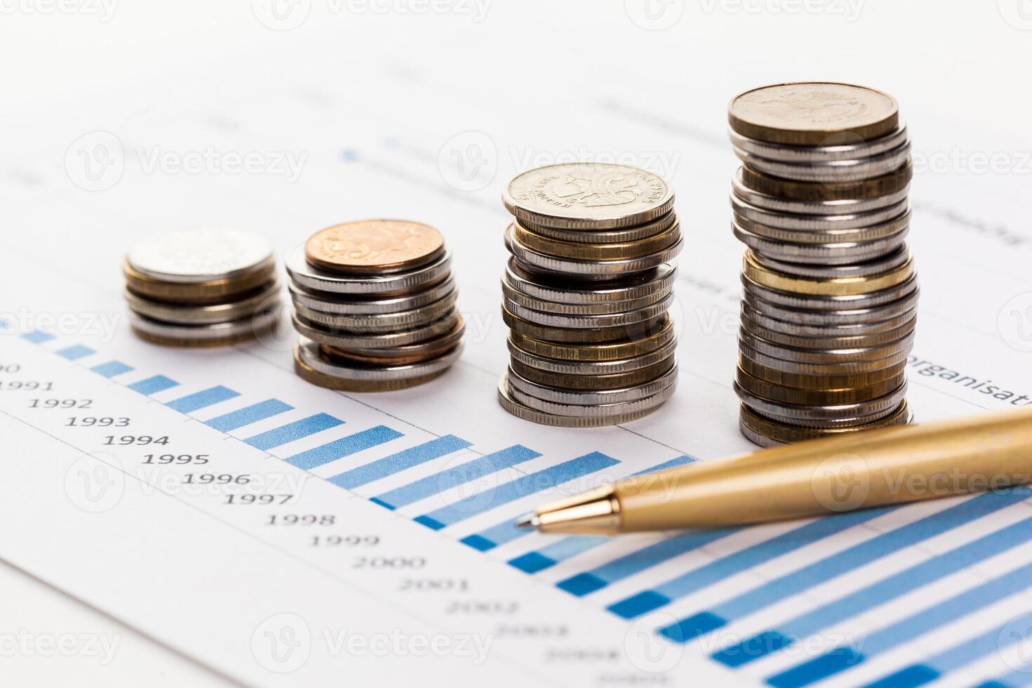 Graph Of Stock Market With Stacks Of Coins photo