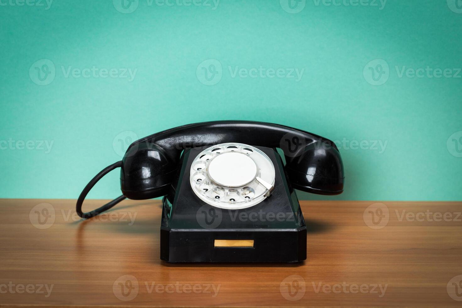 Retro telephone on table photo