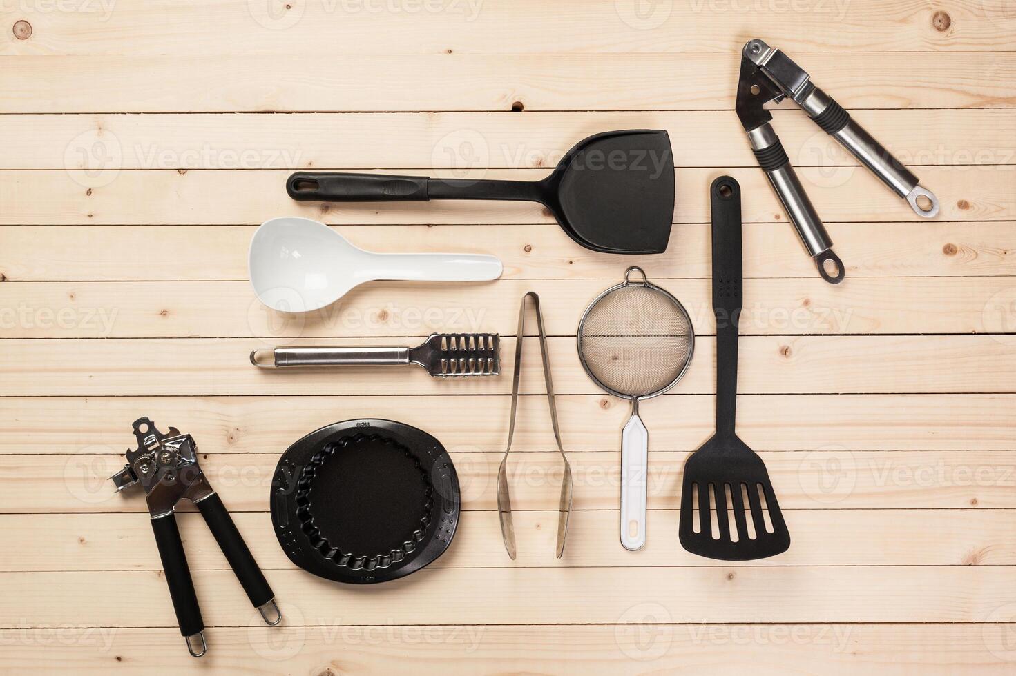 cookware and accessories on a wooden table. photo