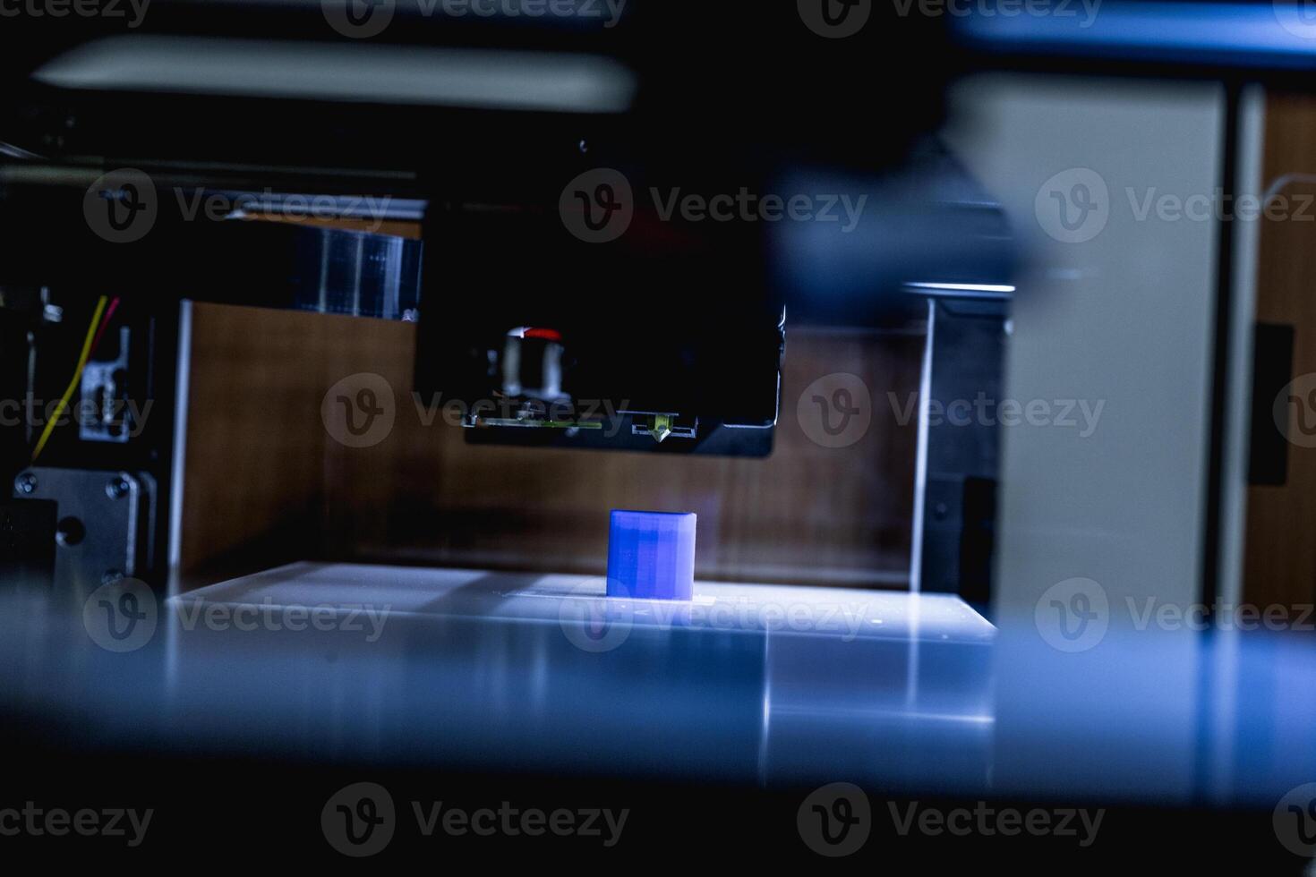head of 3d printer in action photo