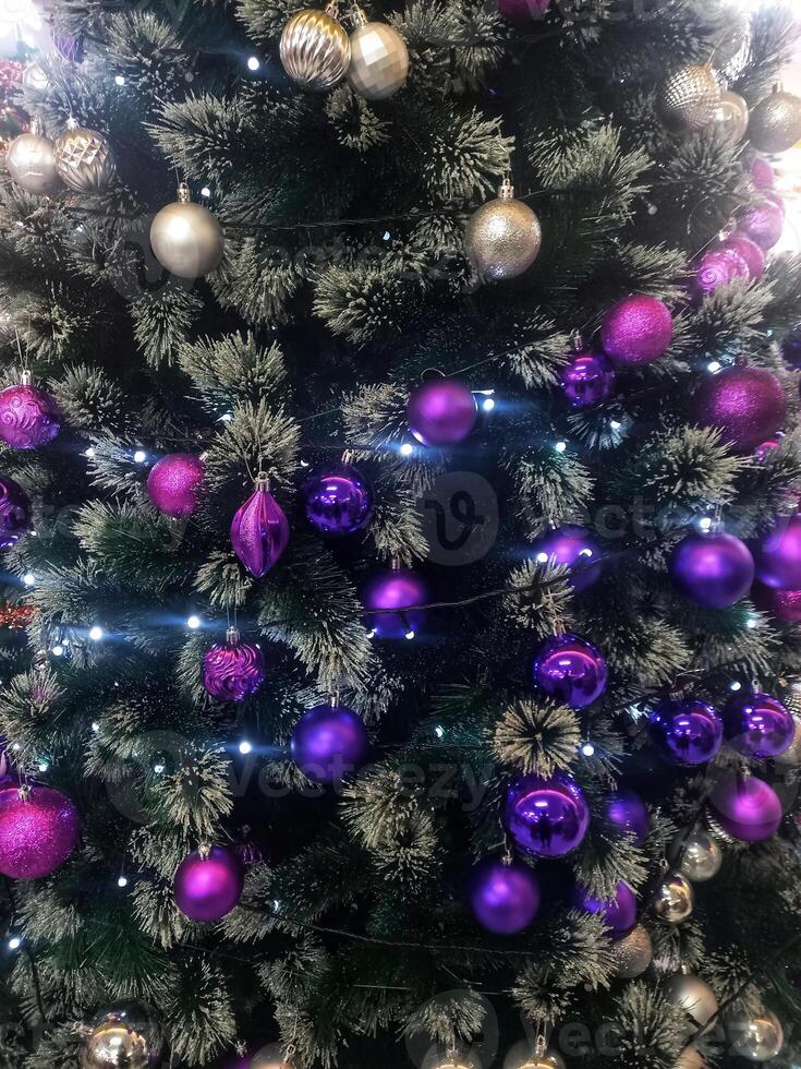 Christmas tree with shiny hanging decorations photo