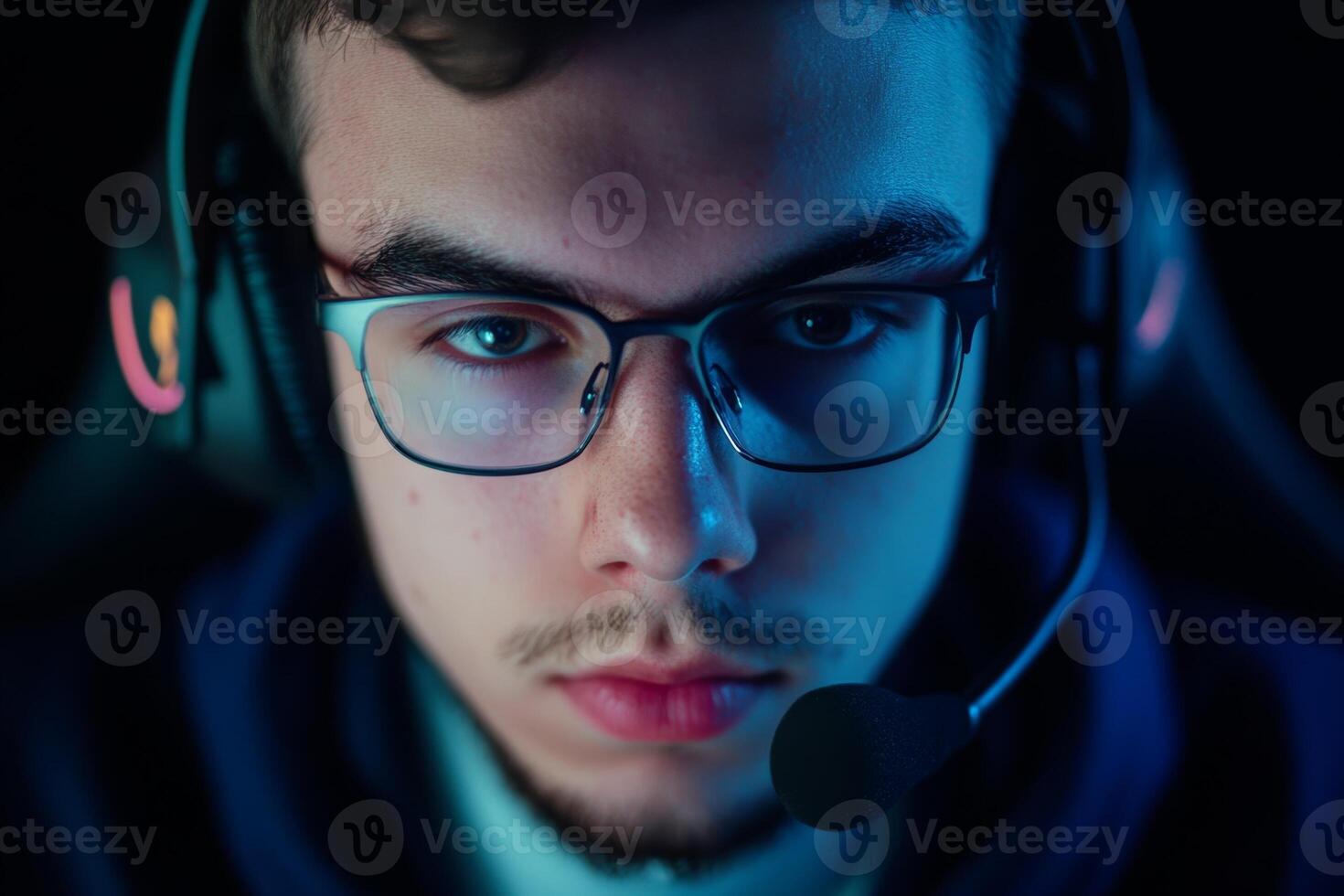 Young gamer focused on competitive play during late-night gaming session in a dimly lit room with vibrant lighting photo
