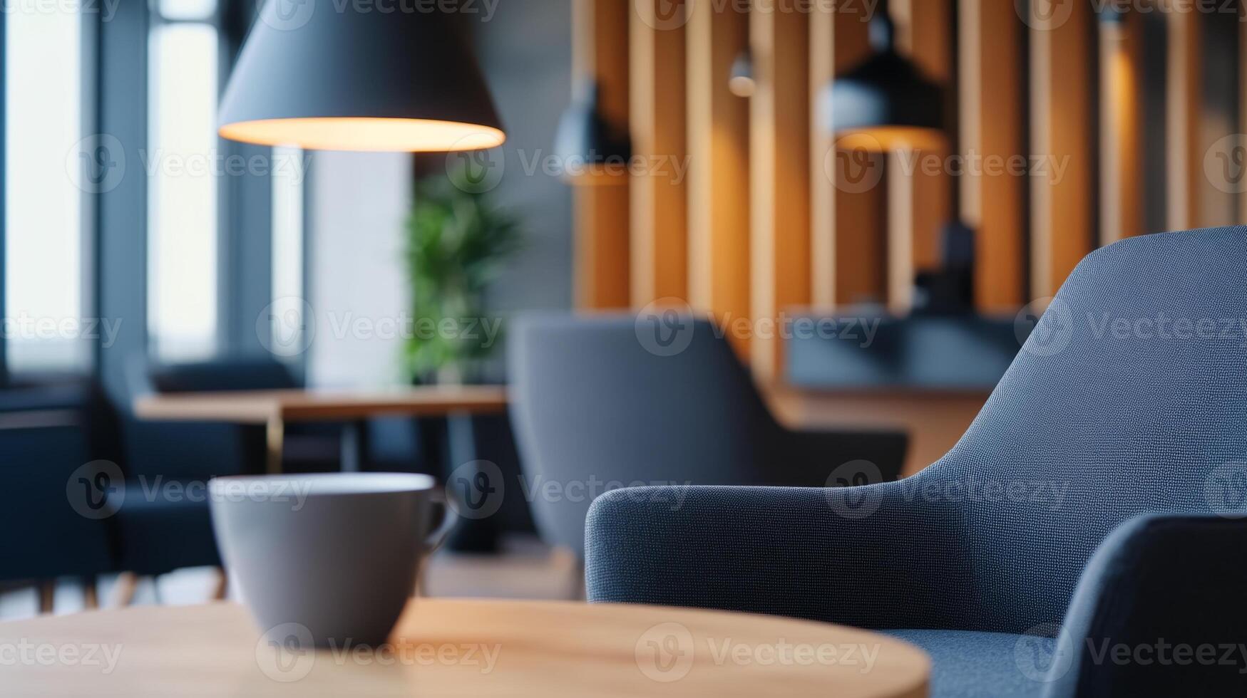 Cozy modern interior of a cafe with a stylish armchair and coffee cup at a well-lit table during the afternoon photo