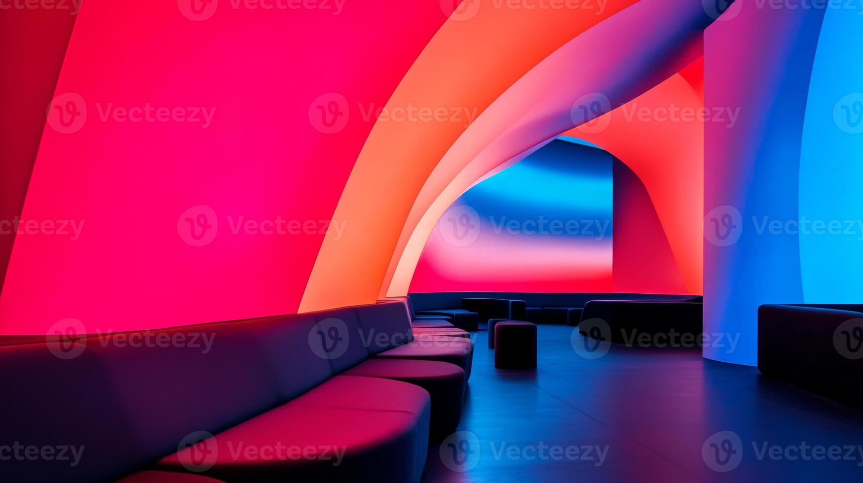 Colorful interior of a modern lounge featuring vibrant light displays and curved architectural design in a contemporary setting photo