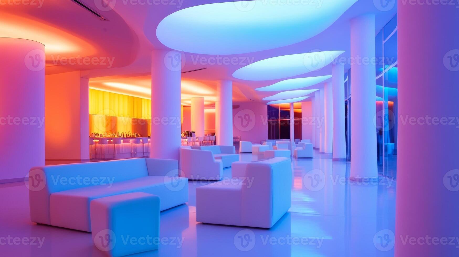 Stylish modern lounge with vibrant lighting in an upscale venue during evening hours photo