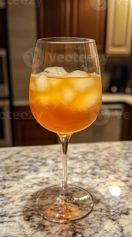 Elegant Orange Cocktail in a Wine Glass photo