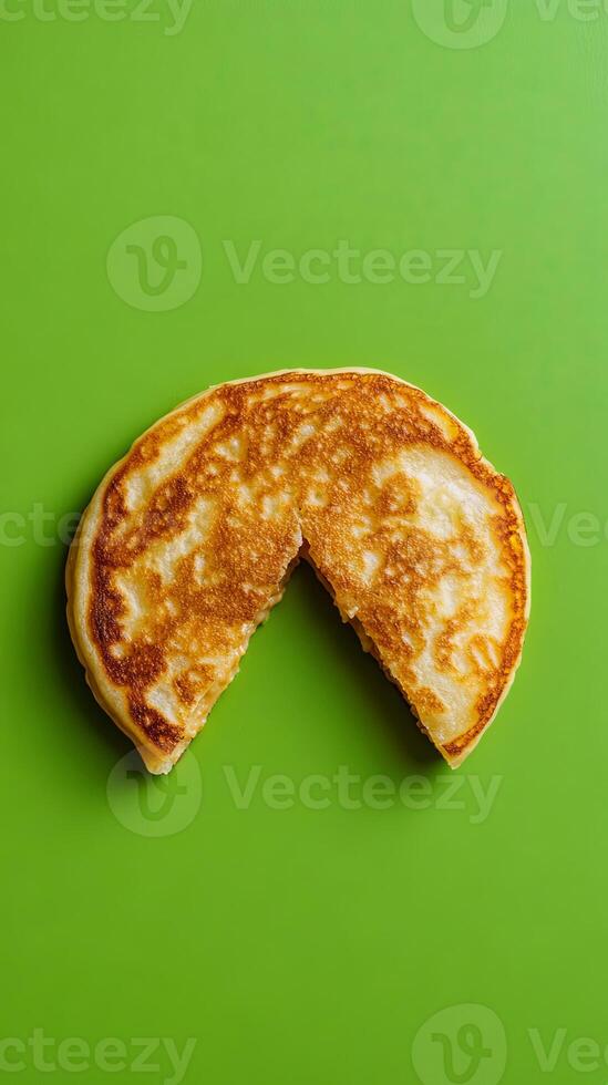 A mouthwatering slice of golden pancake photo