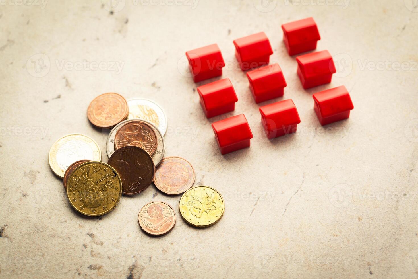 Mortgage concept by model house with coins photo