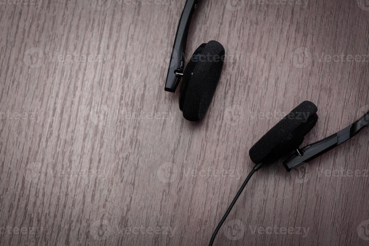 headphones on wooden background photo