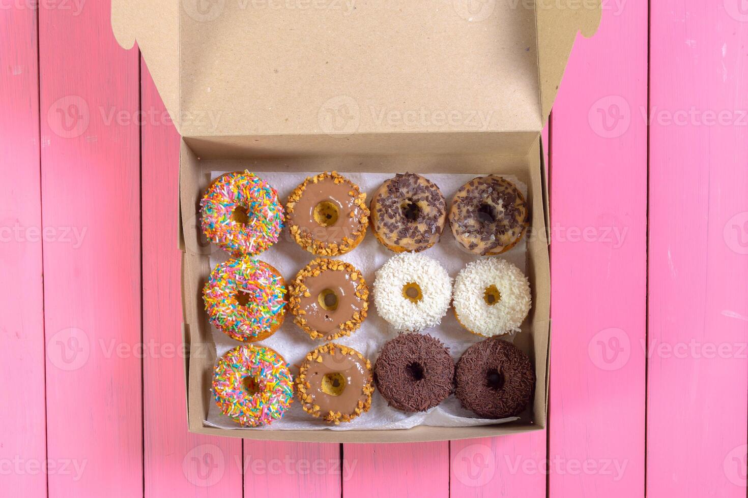 Colorful donuts in box photo