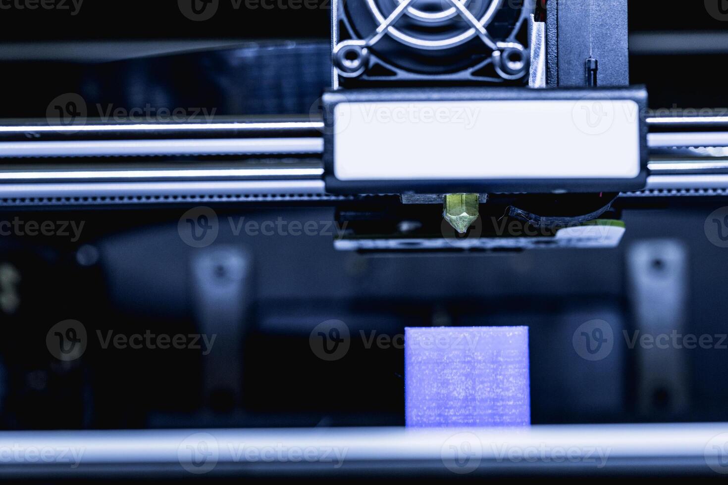 head of 3d printer in action photo