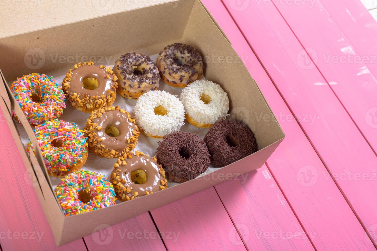 Colorful donuts in box photo