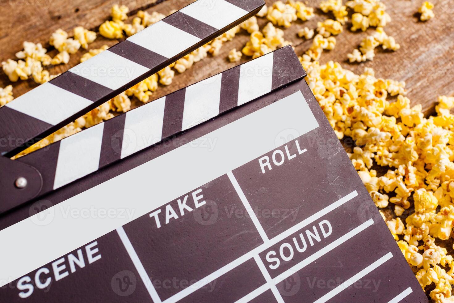 Movie clapper board and pop corn photo