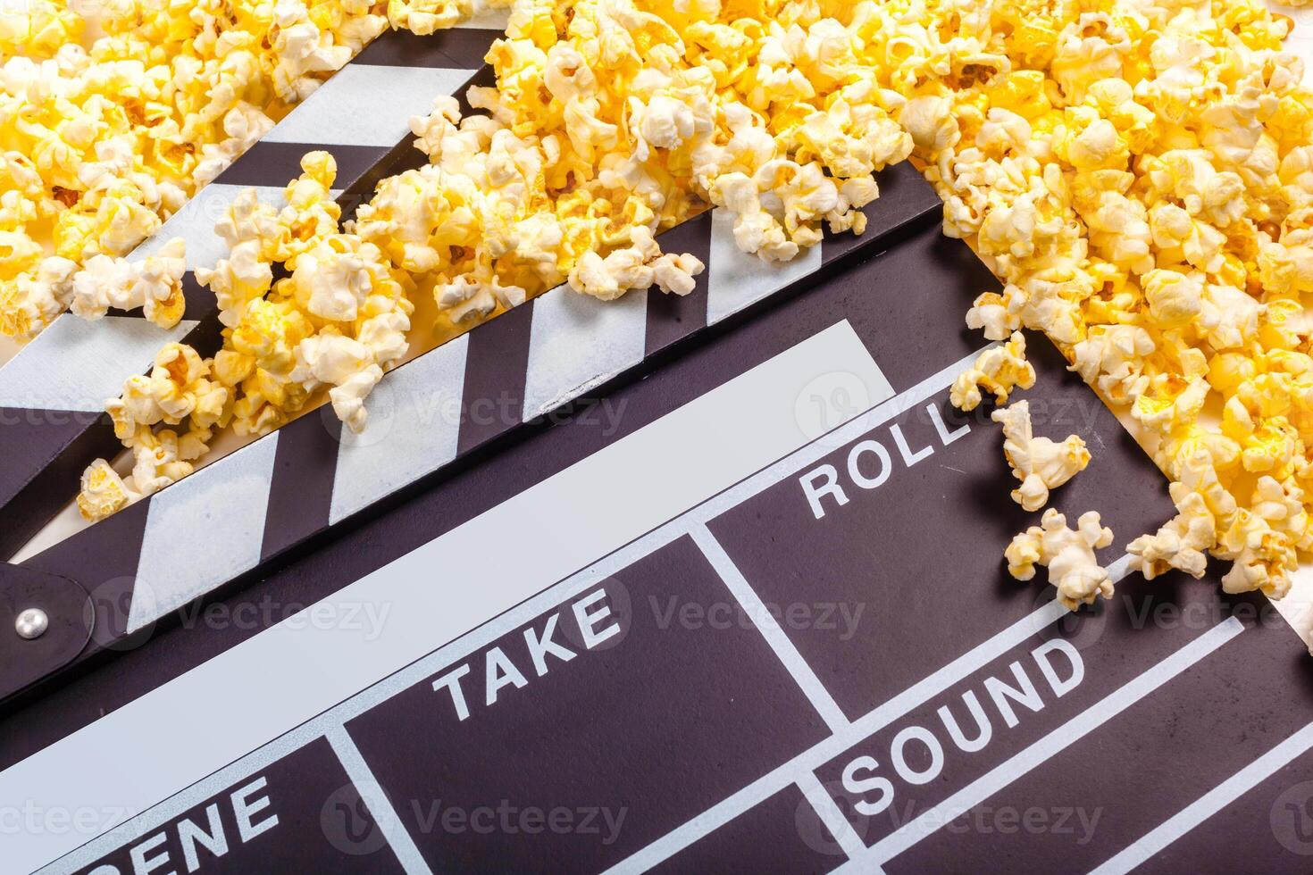 Movie clapper board and pop corn photo