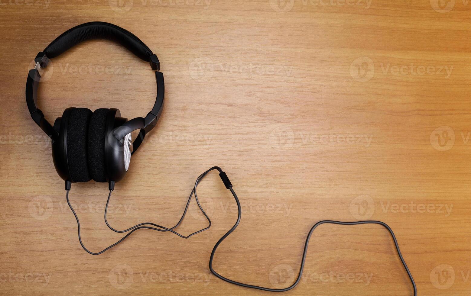 headphones on wooden background photo