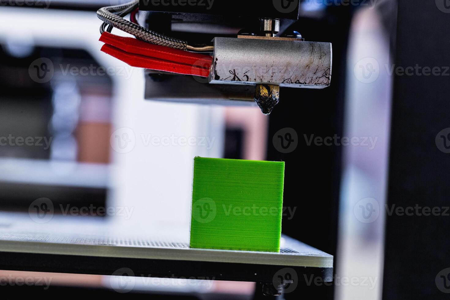 head of 3d printer in action photo